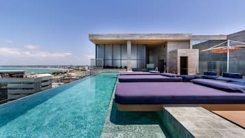 Outdoor pool, open 8:00 AM to 7:00 PM, pool loungers