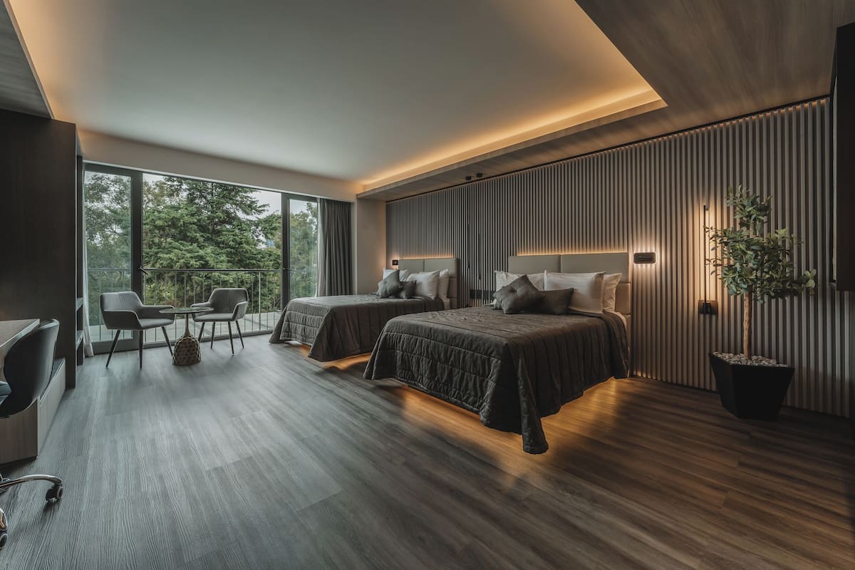 Habitación Deluxe doble | Caja fuerte y ropa de cama