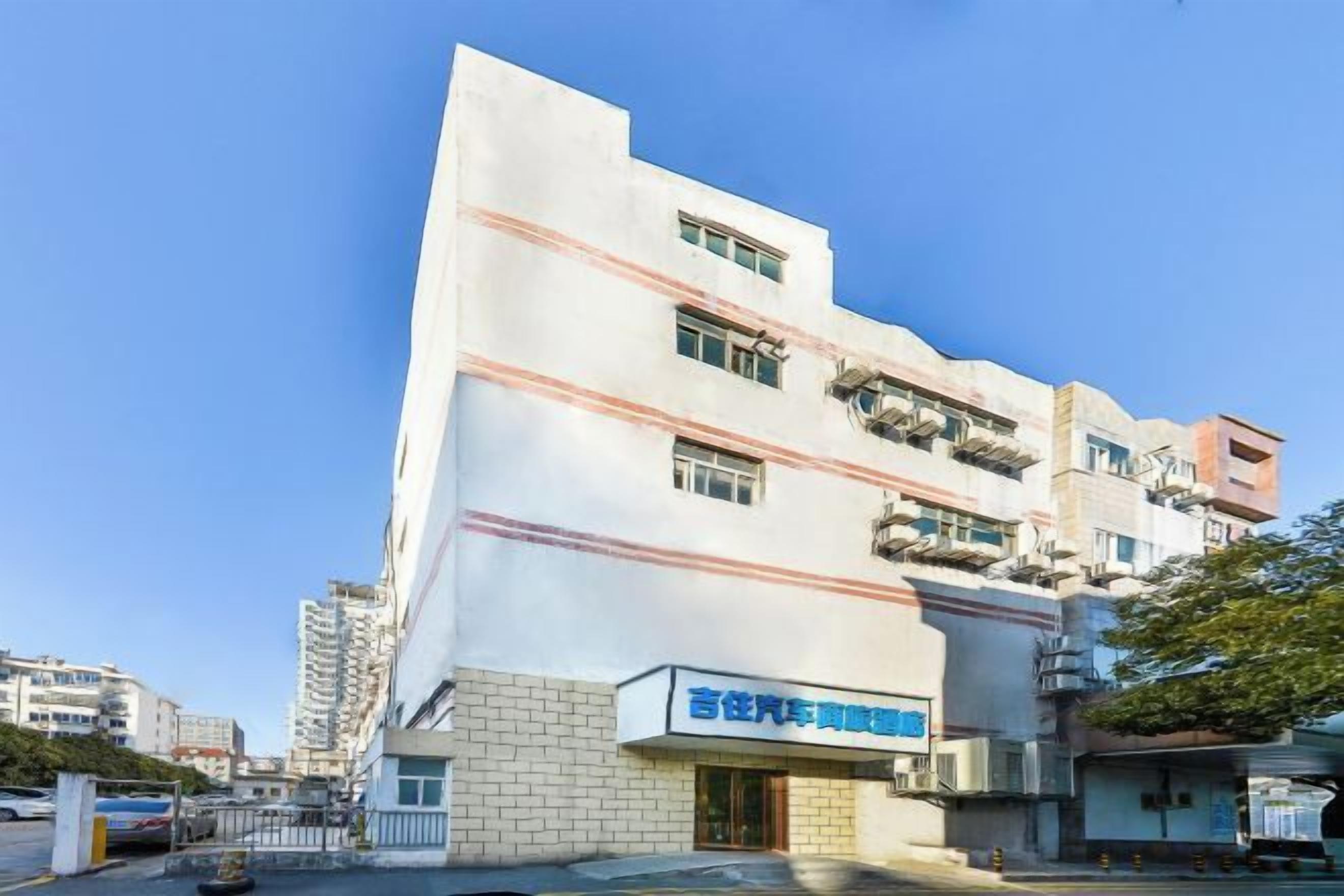 A multi-story building with a sign indicating it is a hospital.