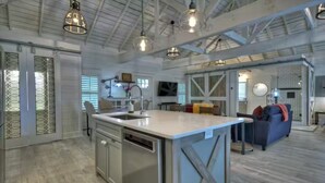 A spacious kitchen with a central island, pendant lighting, and a modern farmhouse aesthetic. - Memory Maker, Top of GA Cottage in charming Mineral Bluff with AC, WiFi (Mineral Bluff)