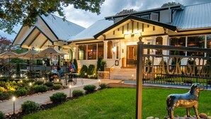 A restaurant with outdoor seating, a well-maintained garden, and a metal fence. - Memory Maker, Top of GA Cottage in charming Mineral Bluff with AC, WiFi (Mineral Bluff)