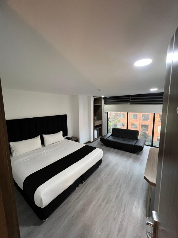 Desk, laptop workspace, blackout curtains, iron/ironing board