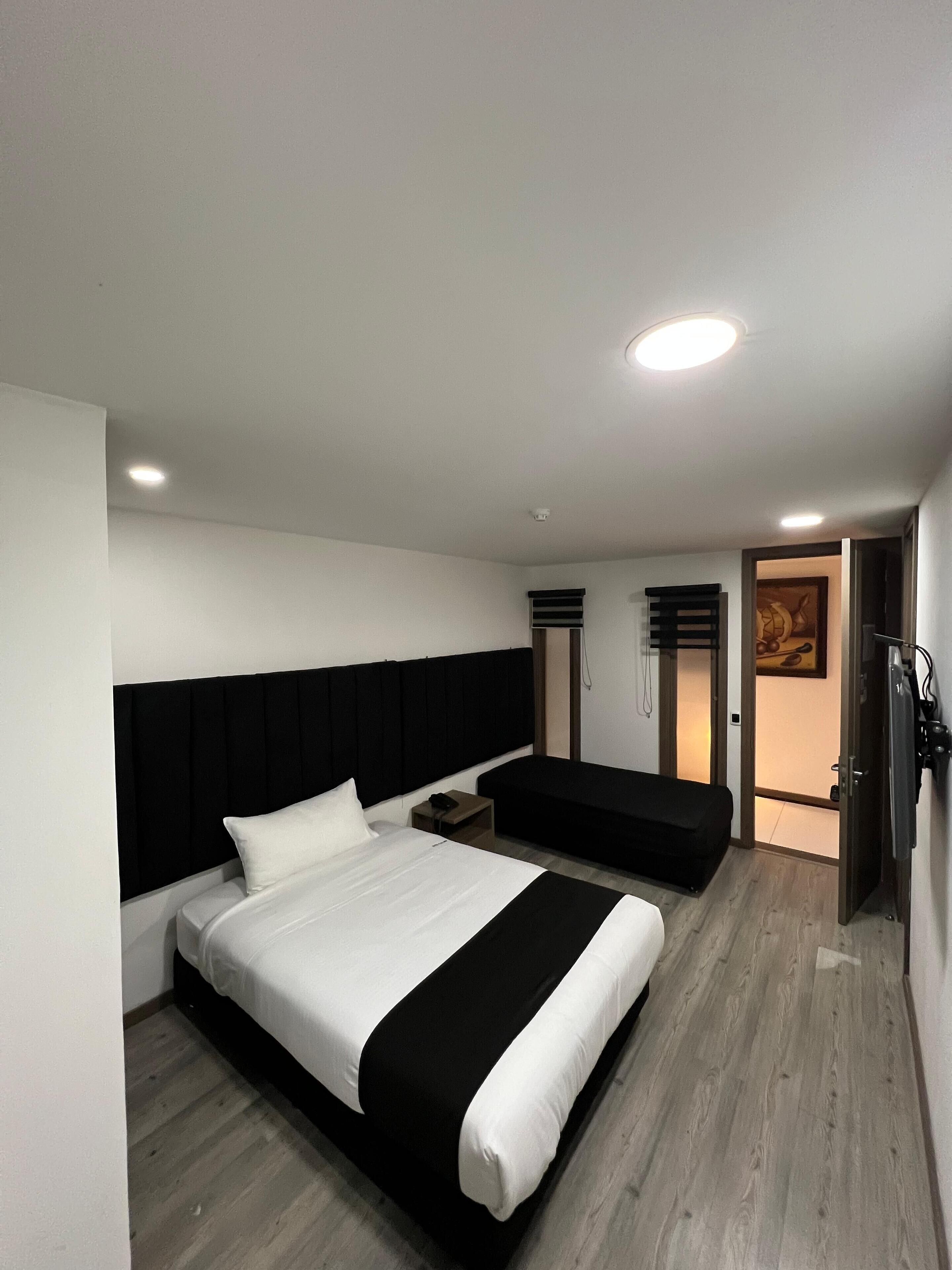 Desk, laptop workspace, blackout drapes, iron/ironing board