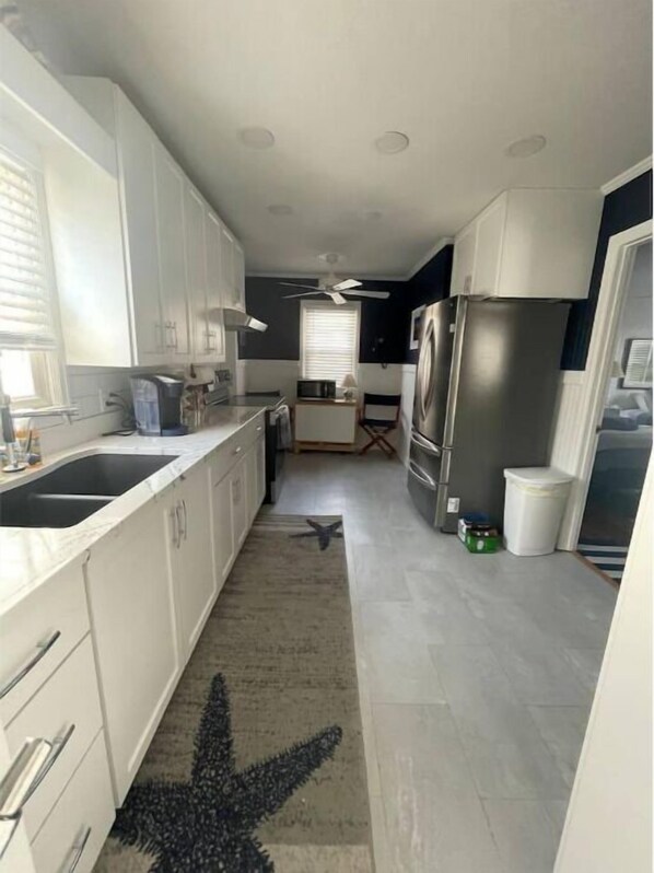 Fridge, microwave, oven, stovetop - Huron Beach Cottage with Game Room (Huron)