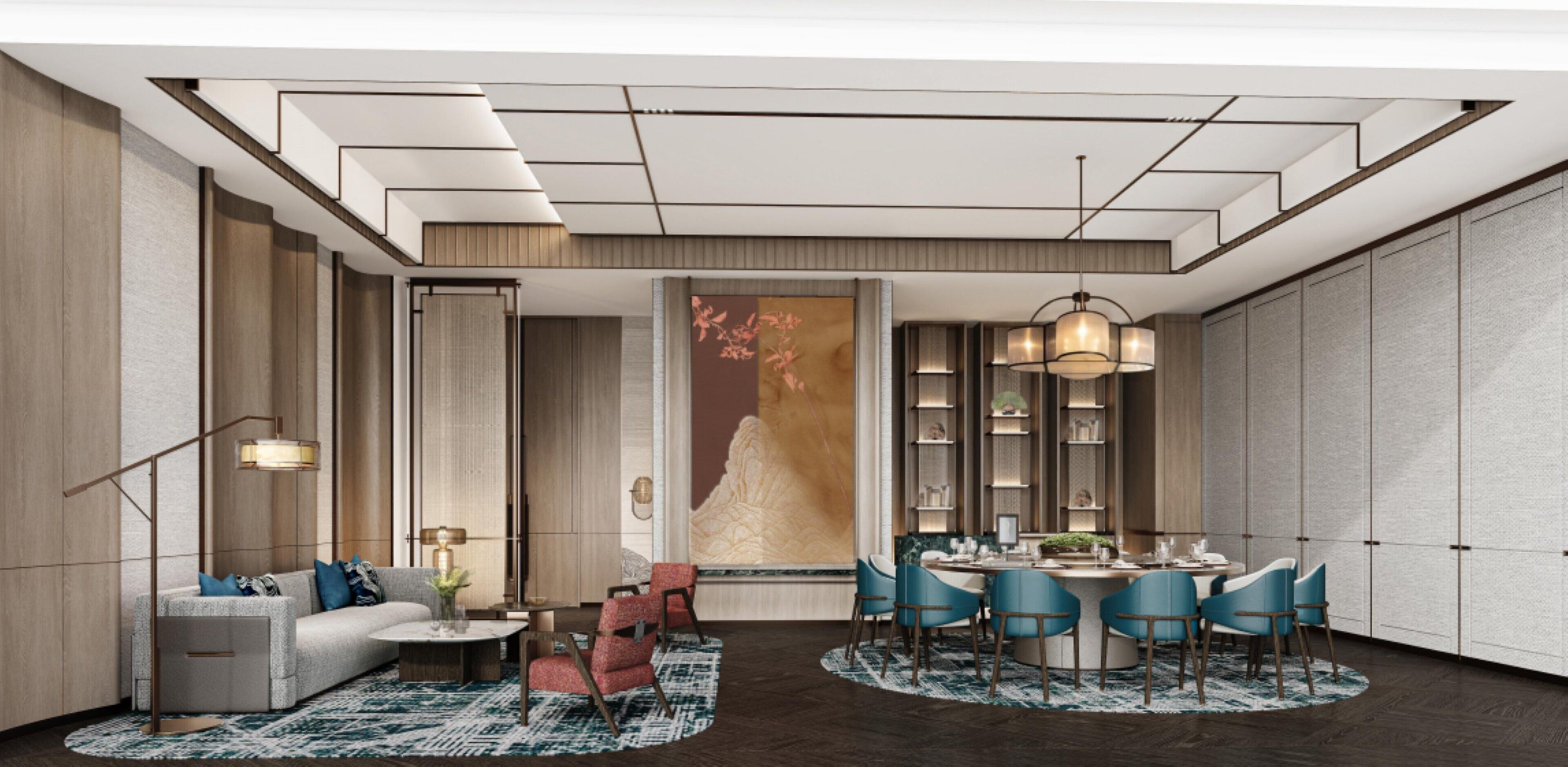 A modern hotel room with a sofa, dining table, chairs, and a large artwork on the wall.