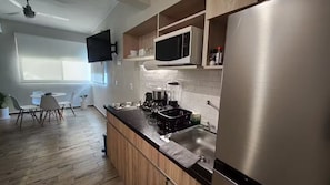 Fridge, microwave, stovetop, coffee/tea maker