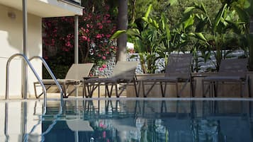 Seasonal outdoor pool, open 9:00 AM to 8:00 PM, free pool cabanas