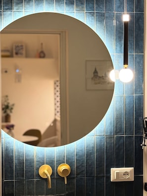 Shower, hair dryer, slippers, soap