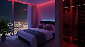 A modern bedroom with a large bed, a nightstand, a potted plant, and a view of a cityscape through a large window. - Modern 3BR - 3BA Apartment with Breathtaking Views (Miami)