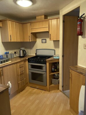 Fridge, microwave, oven, cookware/dishes/utensils