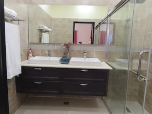 Shower, hair dryer, towels, soap