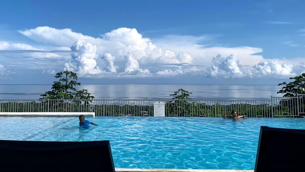 A swimming pool with a view of the ocean and clouds. - Beautiful 3BR villa in Ocho Rios near Dunn's River falls, gorg beaches plus more (Ocho Rios)