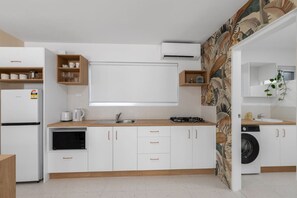 Fridge, microwave, stovetop, coffee/tea maker