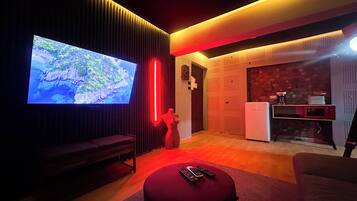 Estudio Deluxe | Área de sala de estar