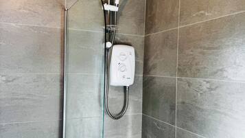 Hair dryer, towels, shampoo, toilet paper