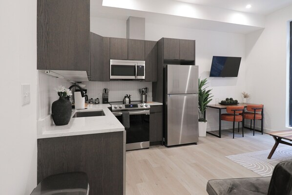 Fridge, toaster, cookware/dishes/utensils, spices