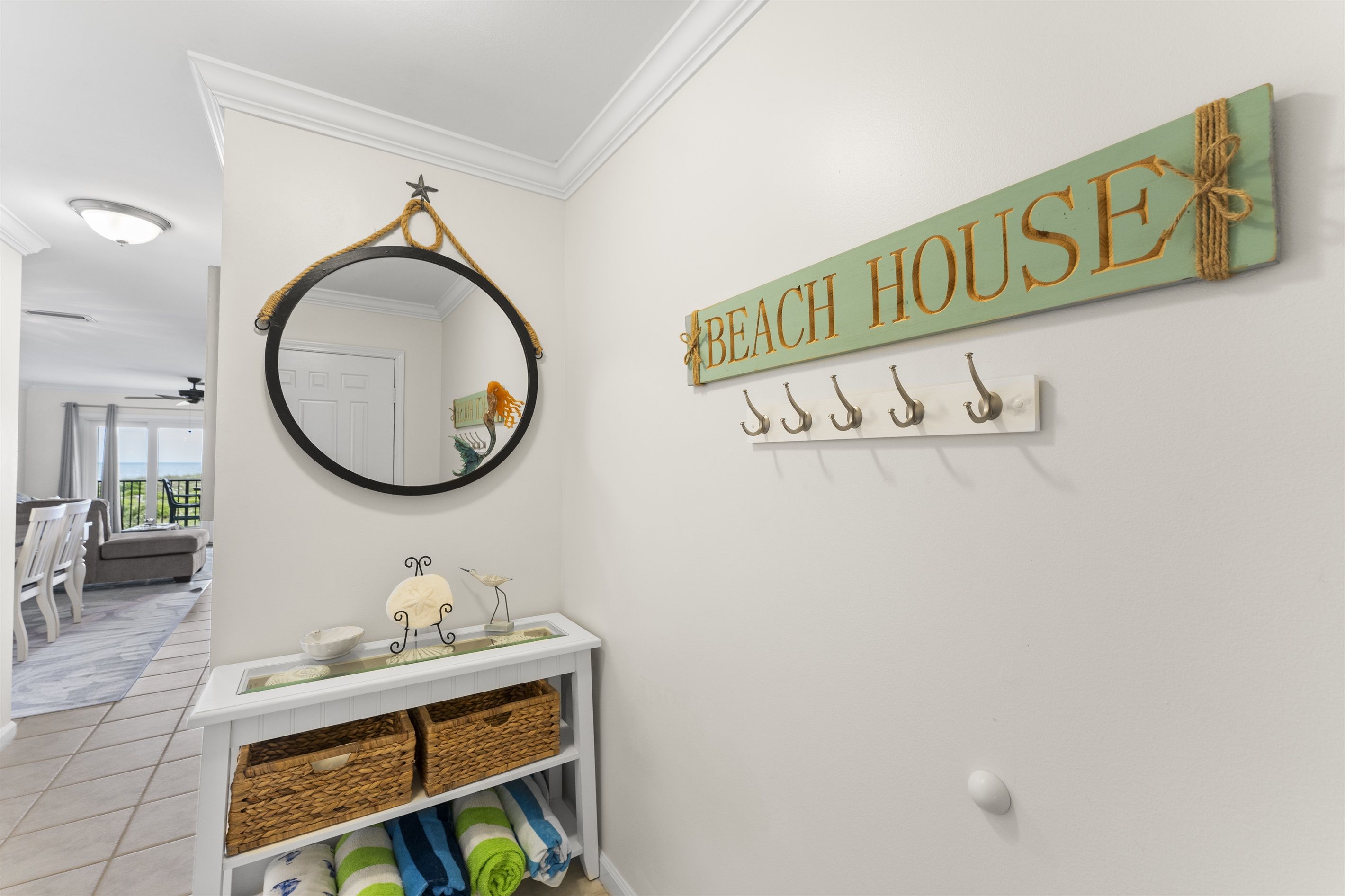 Charming coastal details including a decorative entryway that sets the tone for a relaxing beach inspired stay. Beach towels included!