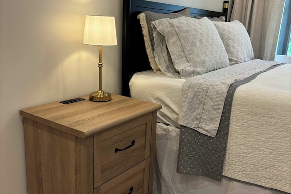 Qn bed w down duvet, nightstand w charging station custom blackout curtains