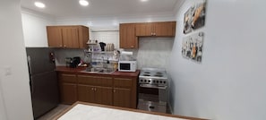 Fridge, microwave, stovetop, coffee/tea maker