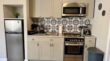 Microwave, oven, coffee/tea maker, cookware/dishes/utensils