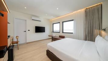 Deluxe Double Room, City View | Desk, laptop workspace, free WiFi, bed sheets