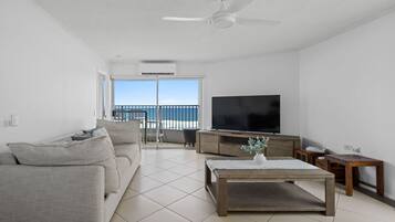 Deluxe Apartment, 2 Bedrooms, Balcony, Ocean View | Living room | 45-inch Smart TV with cable channels