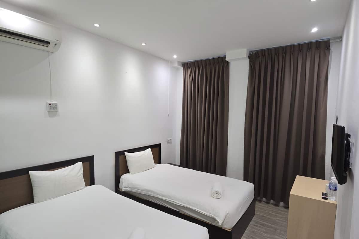 Chambre avec lits jumeaux | Bureau, Wi-Fi gratuit
