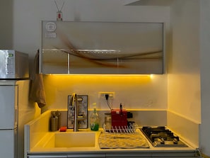 Fridge, microwave, stovetop, coffee/tea maker