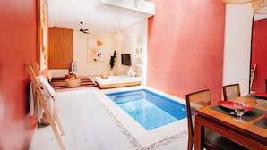 A modern interior with a pool, wooden furniture, and a dining area. - Exquisite 2 Bedroom Retreat Nestled In The Serene Pecatu (pecatu)