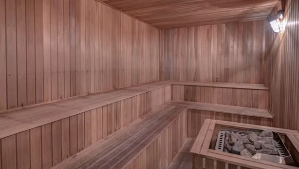 A sauna with wooden walls and benches. - Indoor Pool, Hot Tub, Storyland (Bartlett)