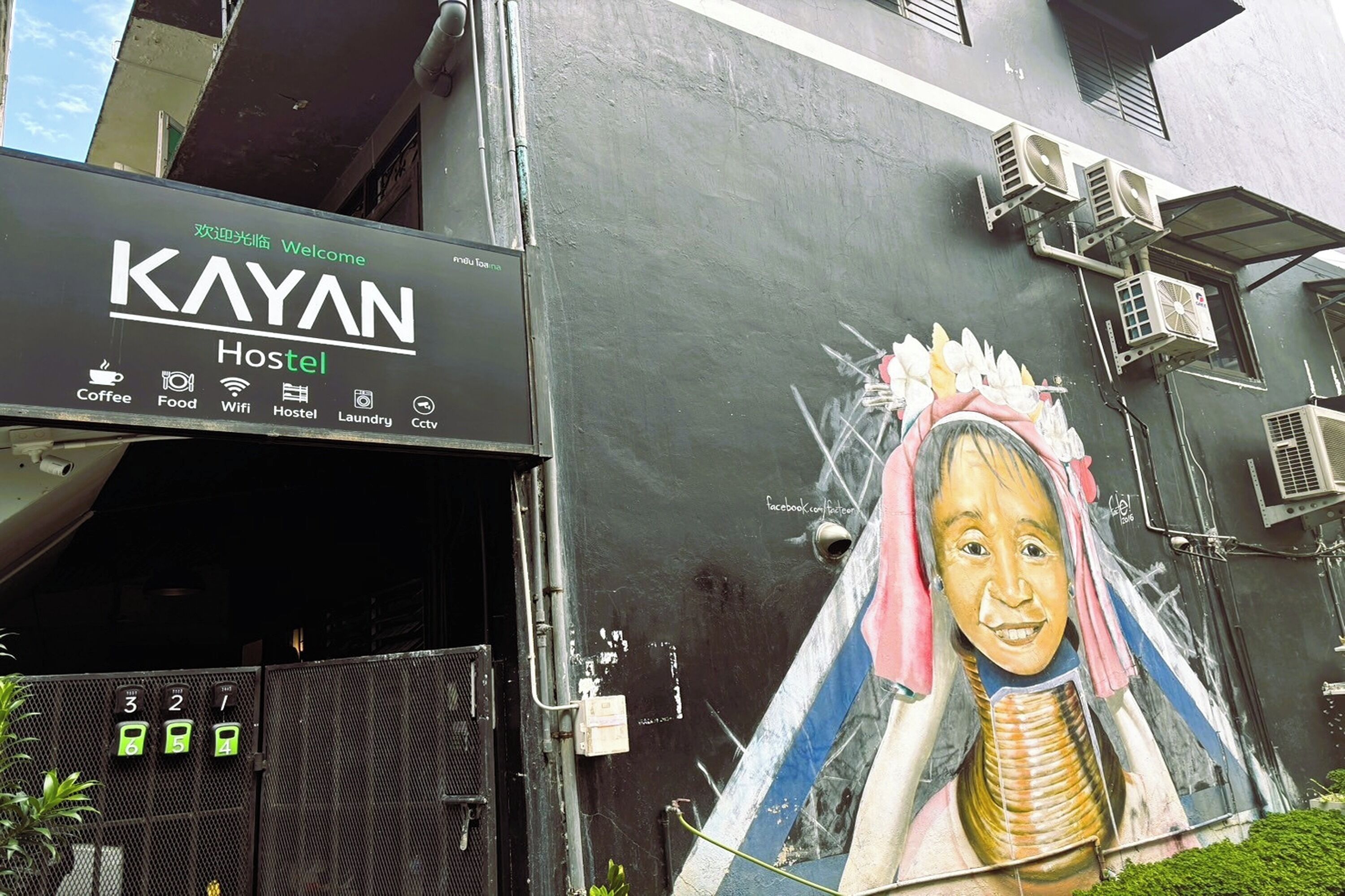 A hostel named KAYAN with amenities like coffee, food, wifi, laundry, and CCTV.