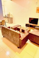 Villa | Living area | 32-inch flat-screen TV with cable channels
