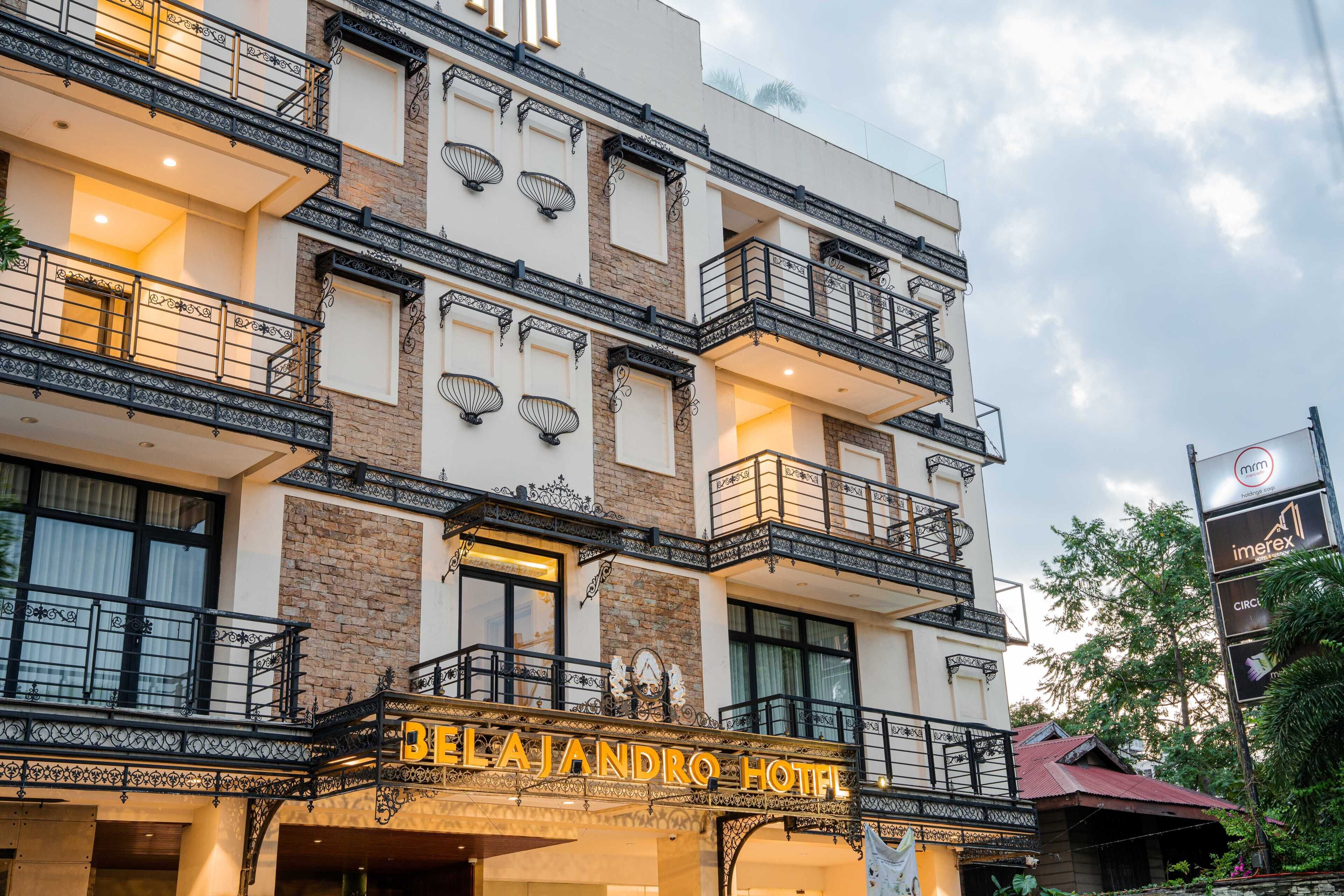 A multi-story hotel with balconies, a prominent entrance, and a sign reading 'BELAJANDRO HOTEL'.