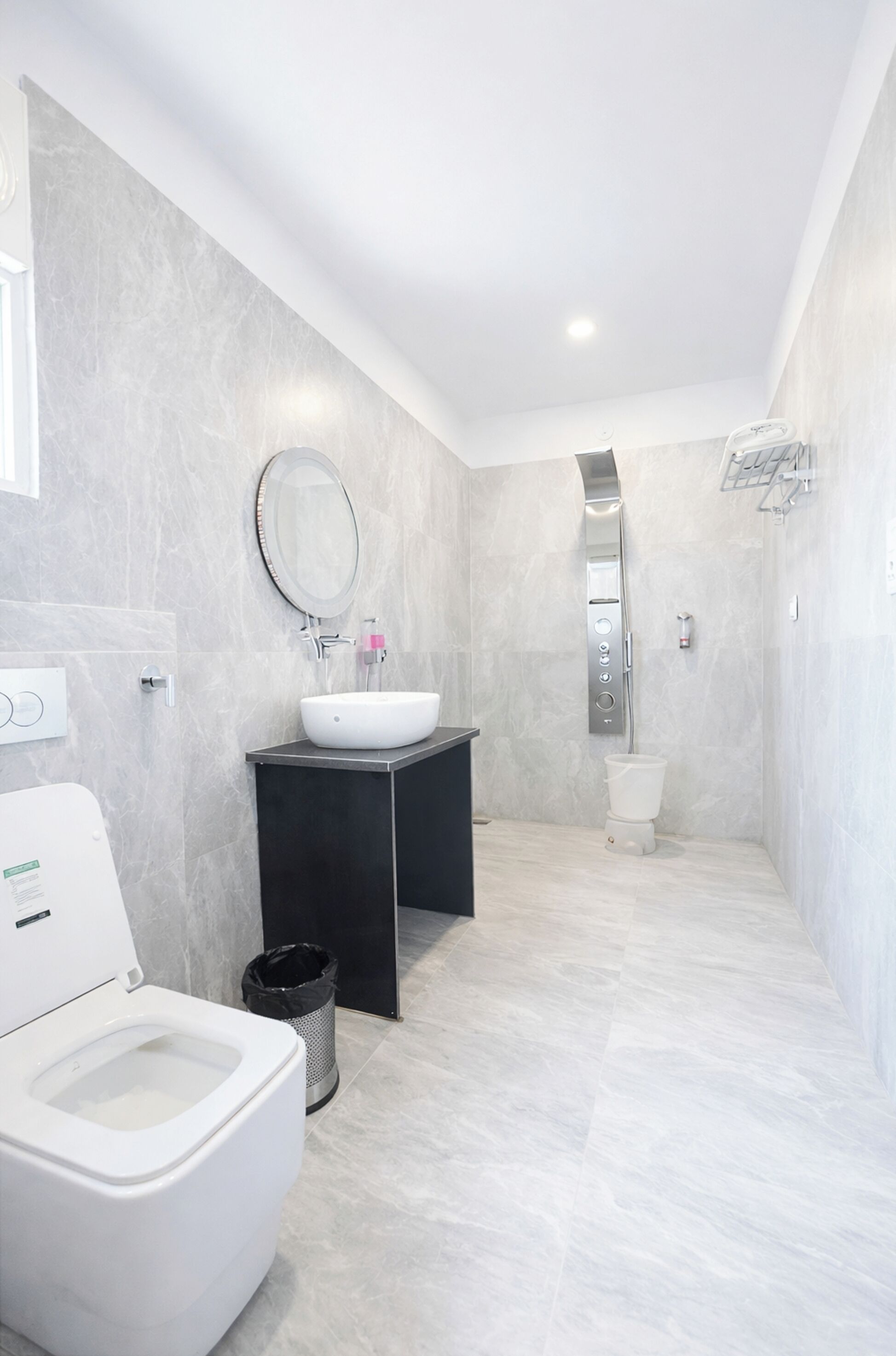 Shower, rainfall showerhead, slippers, towels