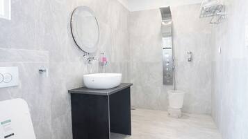 Shower, rainfall showerhead, slippers, towels