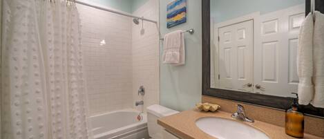 Ensuite bathroom 2 features shower tub combo (Unit 102)