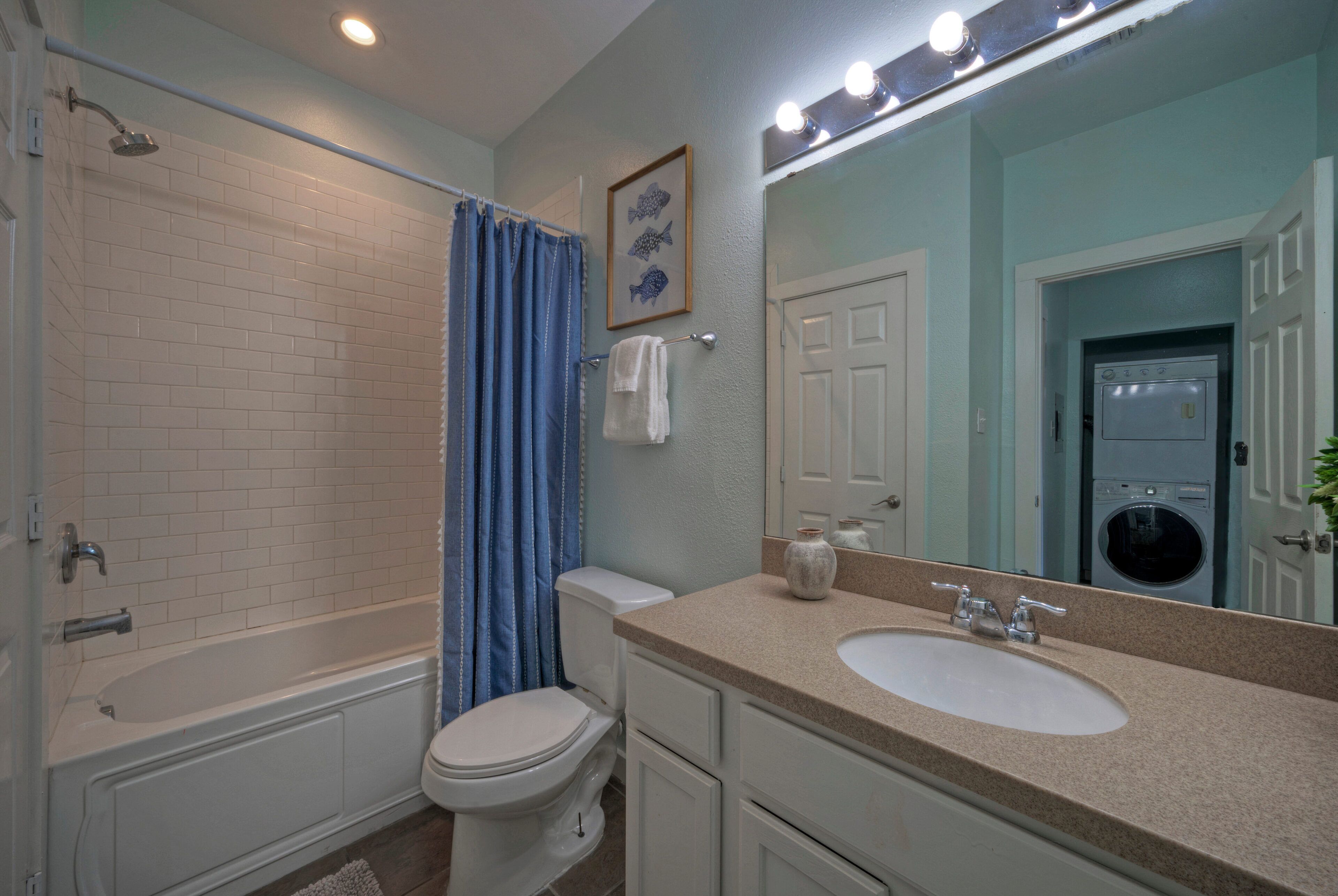 The ensuite bathroom features a shower/tub combo (Unit 105)