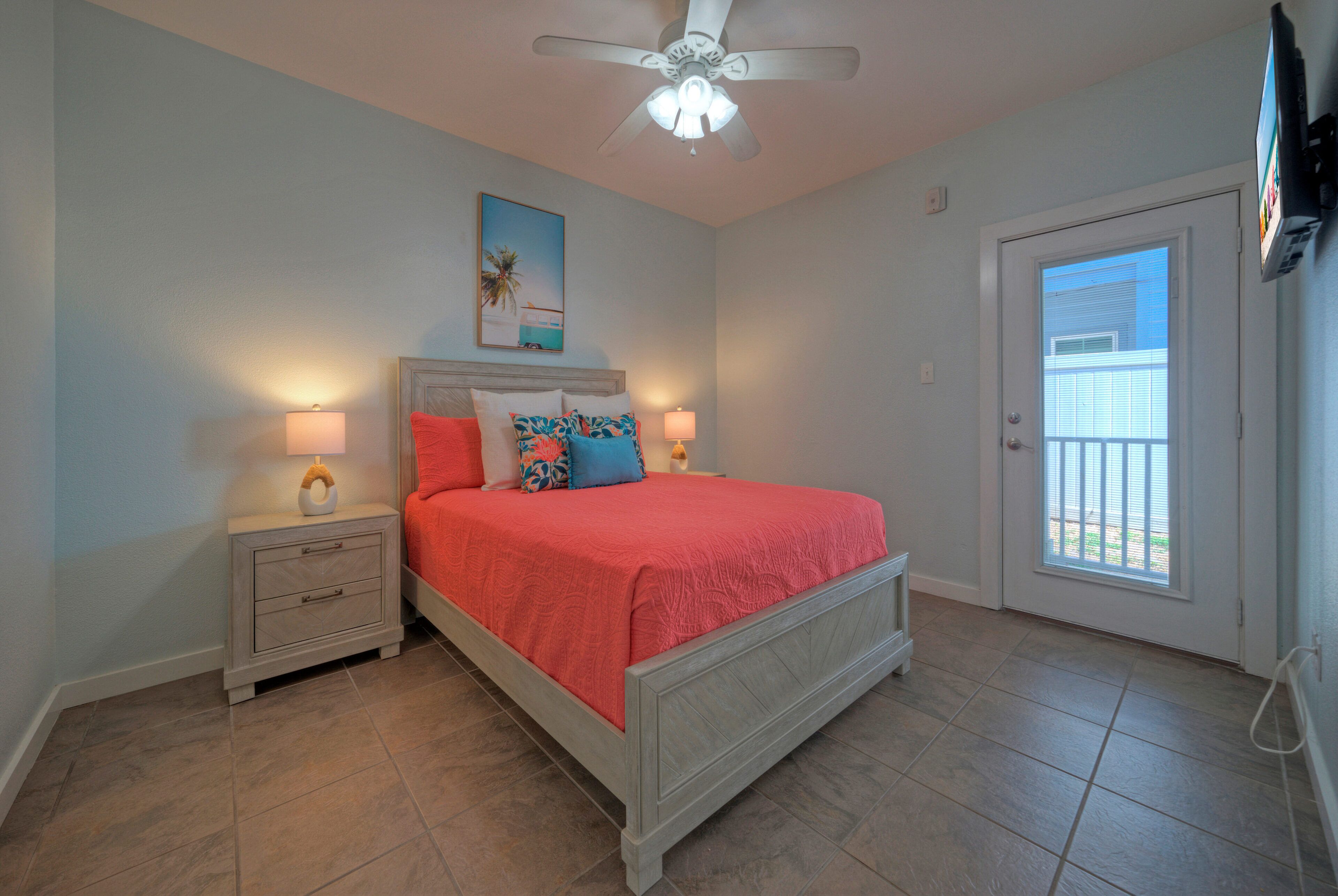 Bedroom 2 features a queen bed and an ensuite bathroom. (Unit 107)