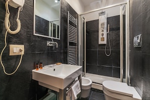 Shower, free toiletries, hair dryer, towels