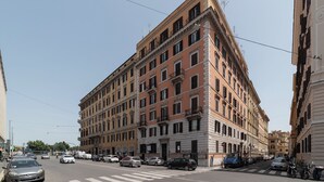 A multi-story building with a classic architectural style, featuring a central entrance and multiple windows. - S. Marco Guesthouse (Rome)