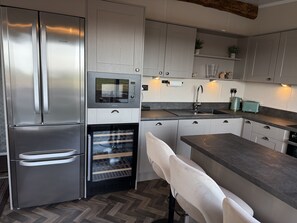 Fridge, microwave, oven, cookware/dishes/utensils