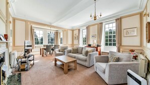 A spacious living room with a fireplace, a wooden coffee table, and a sofa set. - Lodge in Thirsk with Spa & Scenic Countryside (Thirsk)