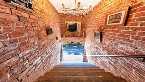 A brick-walled stairway leading to a balcony with a view. - Barn in Lincolnshire near Historic Newark (Newark)