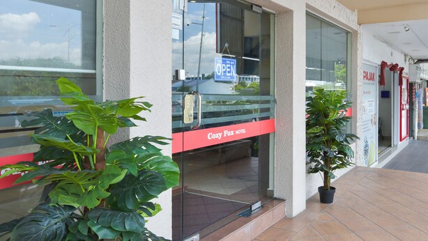 A hotel entrance with a glass door, a 'No Parking' sign, and a 'Welcome' sign. - Hotel O Cozy Fox Hotel (Petaling Jaya)