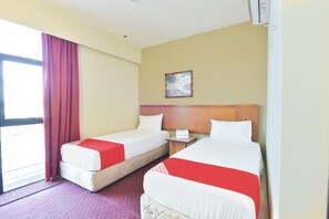 Habitación Deluxe con 2 camas individuales | Wifi gratis y ropa de cama