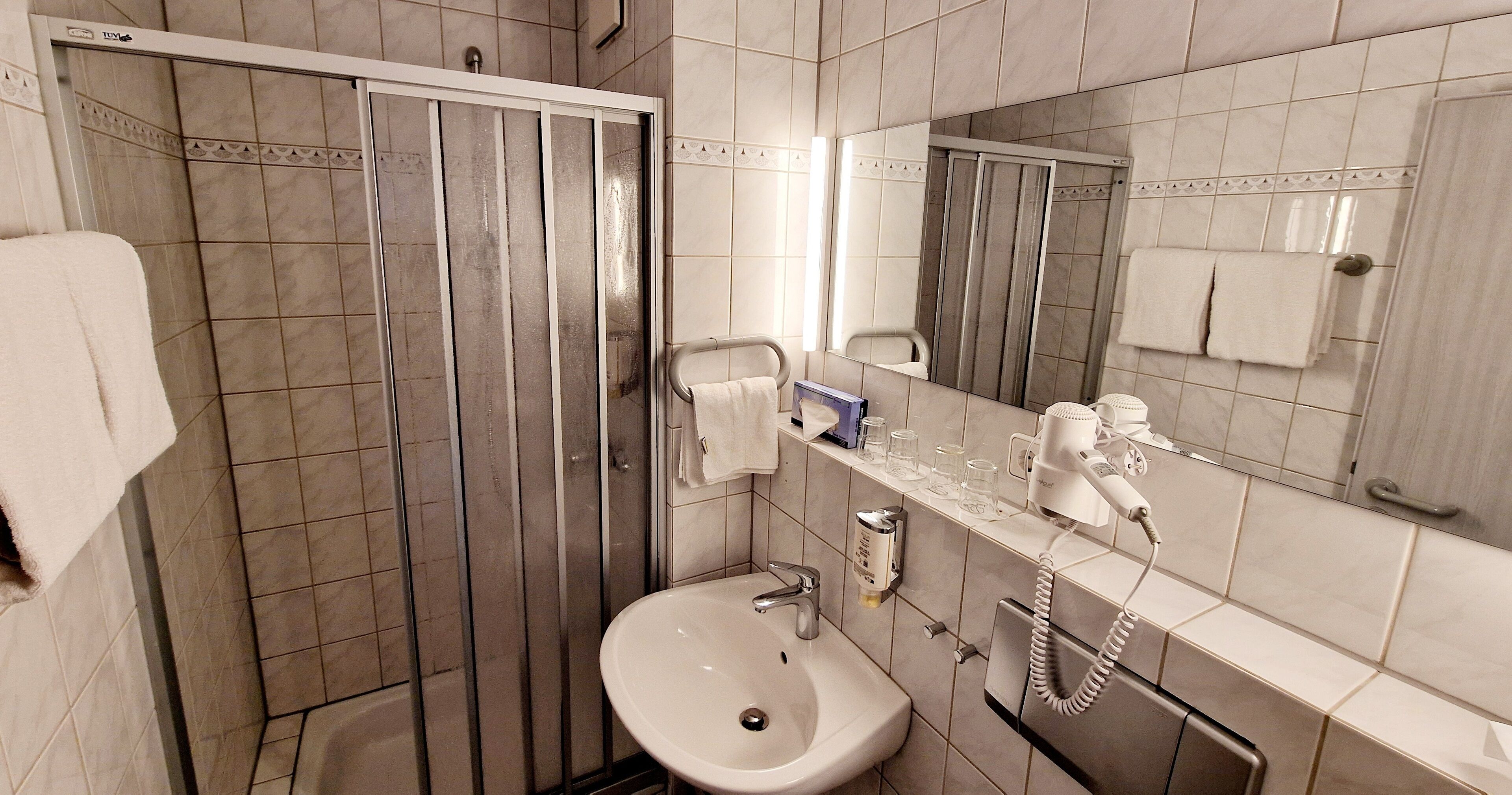 Shower, towels, soap, toilet paper