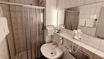 Shower, towels, soap, toilet paper