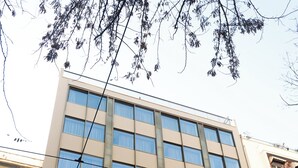 A modern building with the sign 'WYZ' on the facade. - WYZ Museum by UPSTREET (Athens)