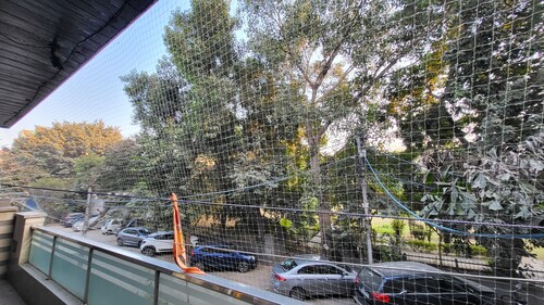 Charming 2-bedroom apartment with AC, WiFi in enchanting Lok Vihar, Delhi