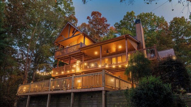 A multi-level wooden cabin with a balcony, surrounded by trees. - Cardinal and Bear Lodge (Blue Ridge)